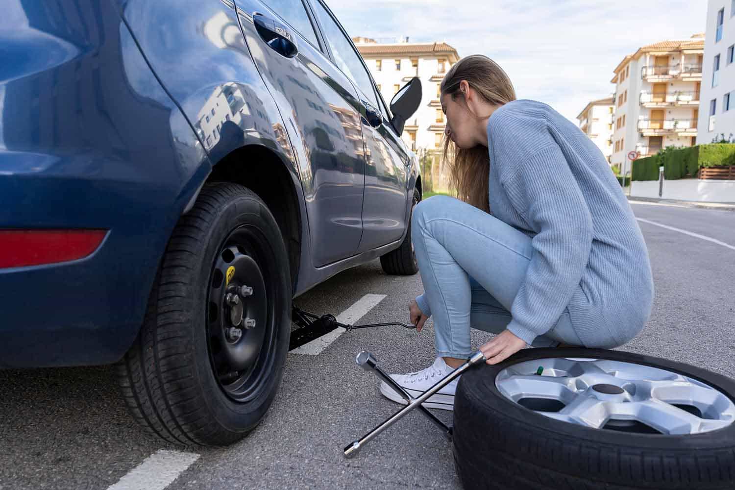 fixing a flat tire - Cash For Cars Houston Texas